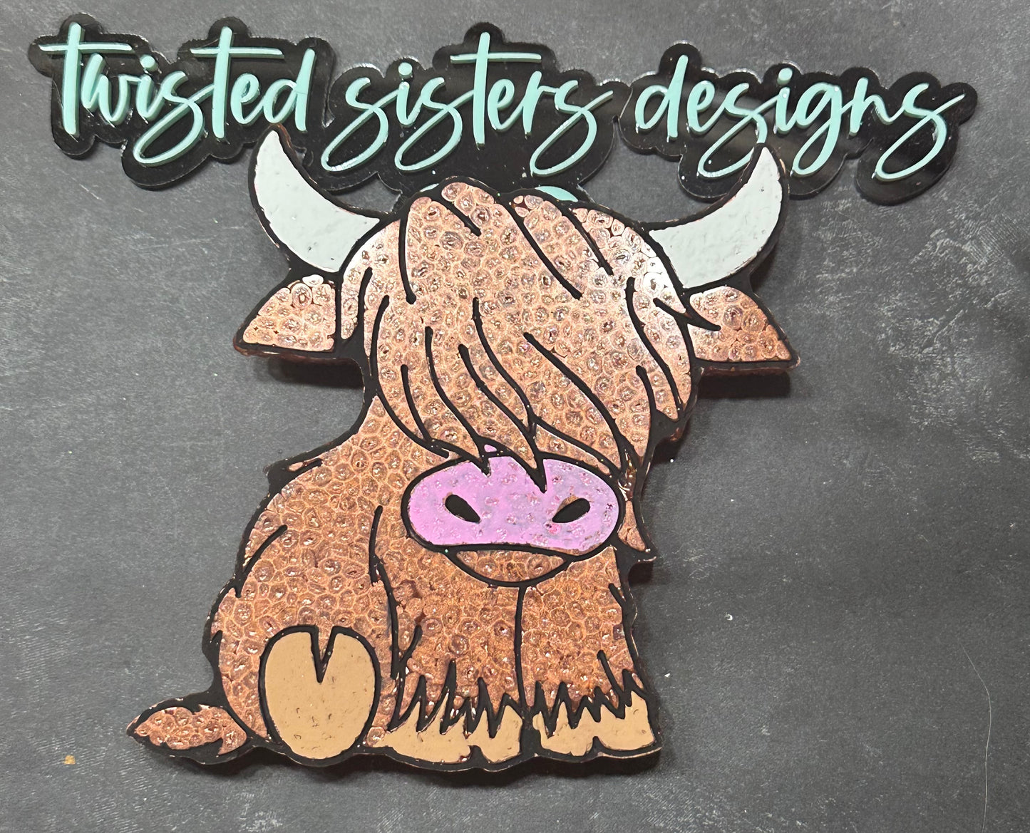 Sitting Highland Cow.